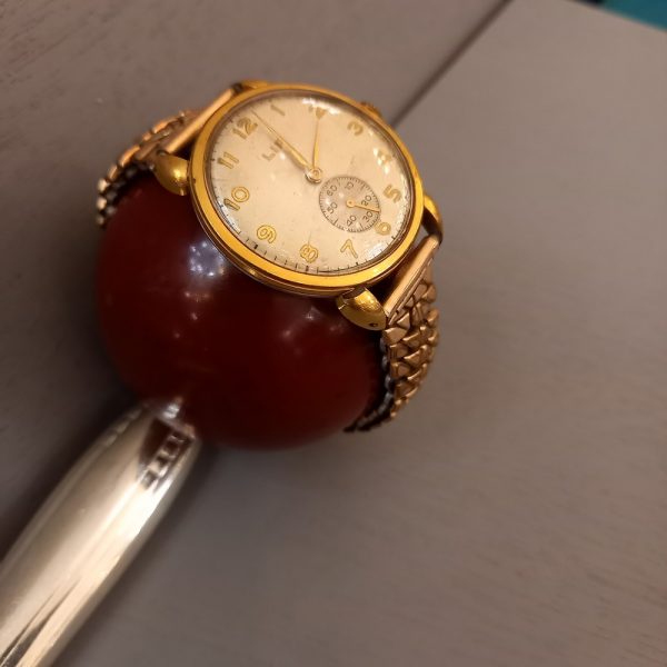 Montre Bracelet LIP 17 jewels antimagnetic Années 50, Vintage Dos en Acier inoxydable Bracelet métal doré élastique état de marche